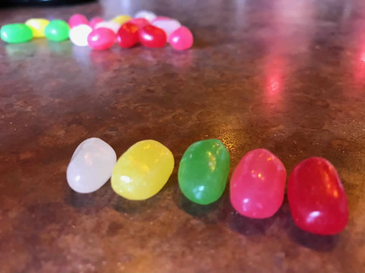 A line of the five individual colors of beans in the package