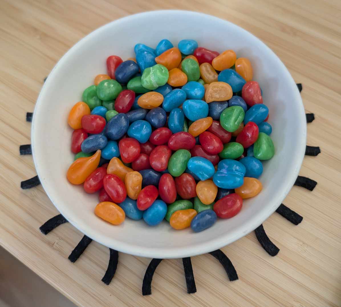 A sampling of Kool-Aid Jelly Beans in a small white bowl